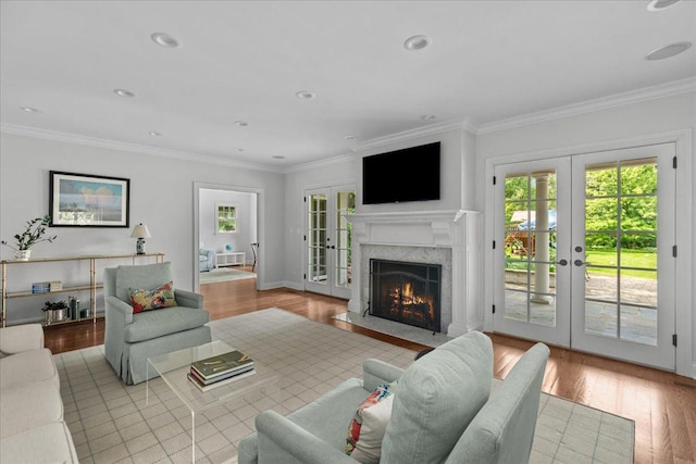 1111 Seneca Rd, Wilmette, IL 60091 - living area with french doors, wood finished floors, a premium fireplace, and ornamental molding