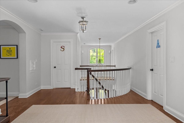 1111 Seneca Rd, Wilmette, IL 60091 - corridor with an upstairs landing, wood finished floors, arched walkways, and crown molding