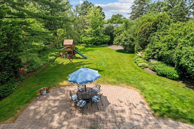 1111 Seneca Rd, Wilmette, IL 60091 - view of patio featuring a playground and outdoor dining space