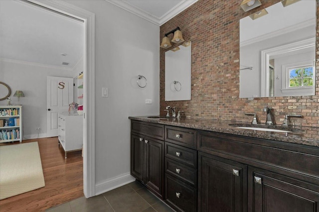 1111 Seneca Rd, Wilmette, IL 60091 - bathroom featuring double vanity, decorative backsplash, tile patterned flooring, ornamental molding, and an enclosed shower