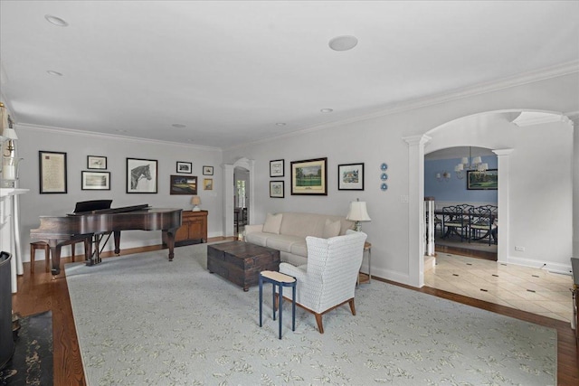 1111 Seneca Rd, Wilmette, IL 60091 - living room featuring arched walkways, decorative columns, crown molding, and wood finished floors