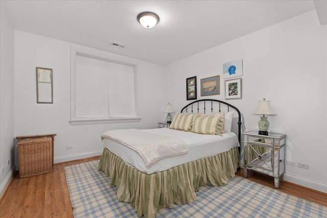 1111 Seneca Rd, Wilmette, IL 60091 - bedroom with wood finished floors and baseboards