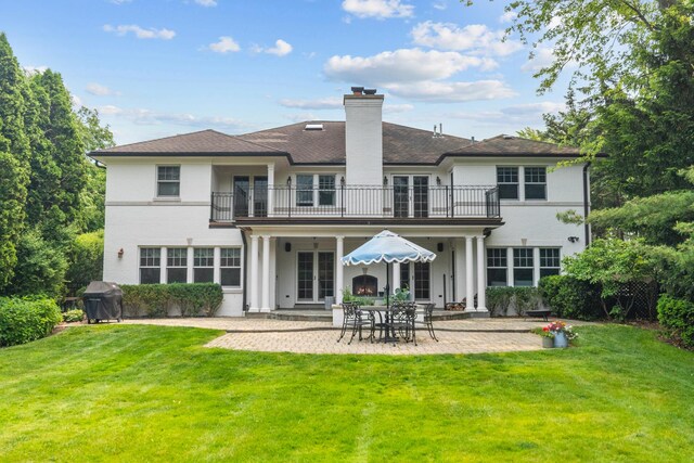 1111 Seneca Rd, Wilmette, IL 60091 - back of house with a balcony, french doors, a yard, and a patio