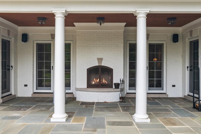 1111 Seneca Rd, Wilmette, IL 60091 - view of patio / terrace with an outdoor brick fireplace
