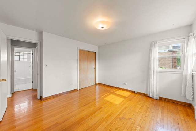 3021 Pearl St, Franklin Park, IL 60131 - unfurnished bedroom with light wood finished floors and a closet