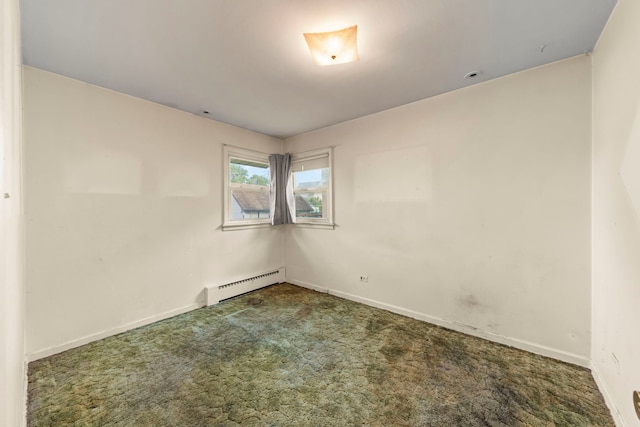 3021 Pearl St, Franklin Park, IL 60131 - spare room featuring a baseboard radiator and carpet floors