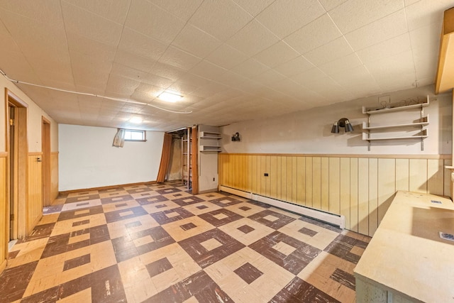 3021 Pearl St, Franklin Park, IL 60131 - below grade area featuring tile patterned floors, baseboard heating, a wainscoted wall, and wooden walls