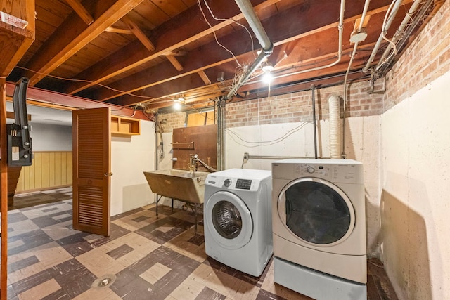 3021 Pearl St, Franklin Park, IL 60131 - washroom with tile patterned floors, washer and dryer, brick wall, a wainscoted wall, and wood walls