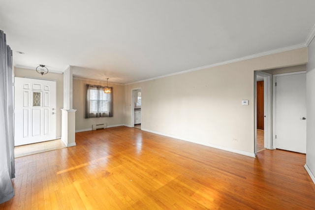 3021 Pearl St, Franklin Park, IL 60131 - unfurnished living room with crown molding, light wood-type flooring, a baseboard radiator, and a chandelier