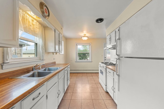 3021 Pearl St, Franklin Park, IL 60131 - kitchen featuring white appliances, a baseboard heating unit, under cabinet range hood, light tile patterned flooring, and white cabinets