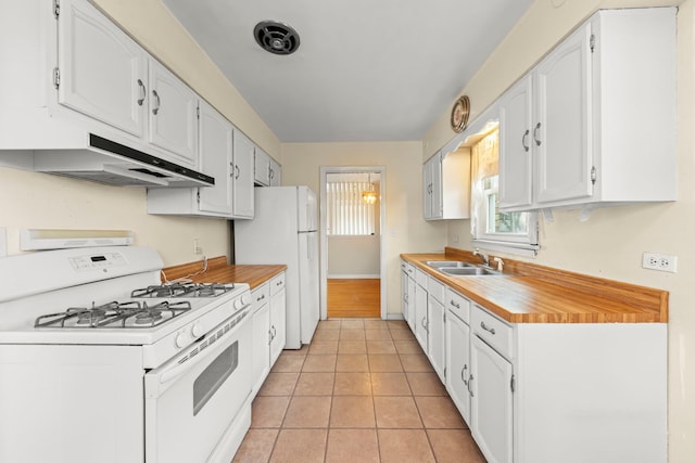 3021 Pearl St, Franklin Park, IL 60131 - kitchen featuring white appliances, under cabinet range hood, white cabinets, light countertops, and light tile patterned flooring