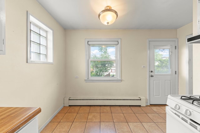 3021 Pearl St, Franklin Park, IL 60131 - unfurnished dining area with light tile patterned floors and a baseboard heating unit
