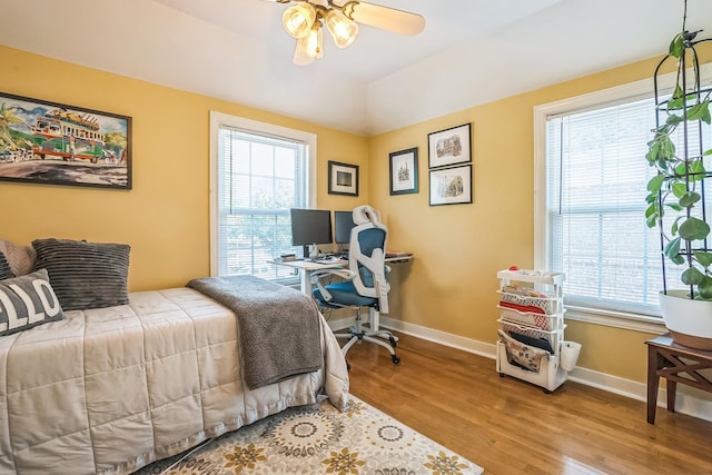 7805 W Farragut Ave, Chicago, IL 60656 - bedroom with multiple windows, wood finished floors, and an office area
