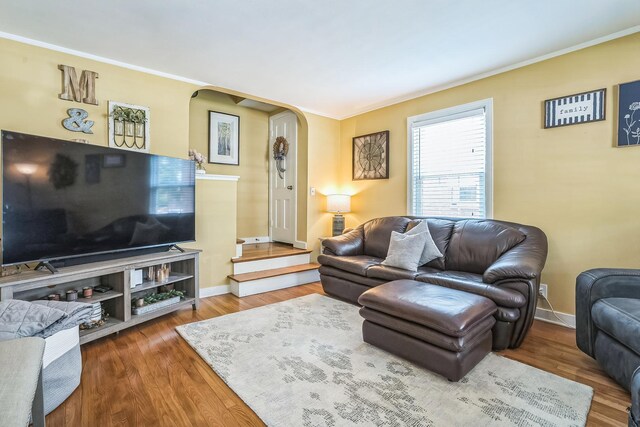 7805 W Farragut Ave, Chicago, IL 60656 - living room with arched walkways, wood finished floors, and crown molding