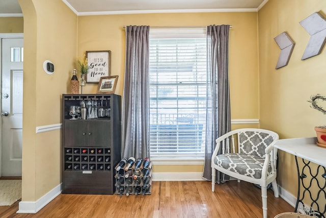 7805 W Farragut Ave, Chicago, IL 60656 - living area featuring arched walkways, wood finished floors, plenty of natural light, and crown molding