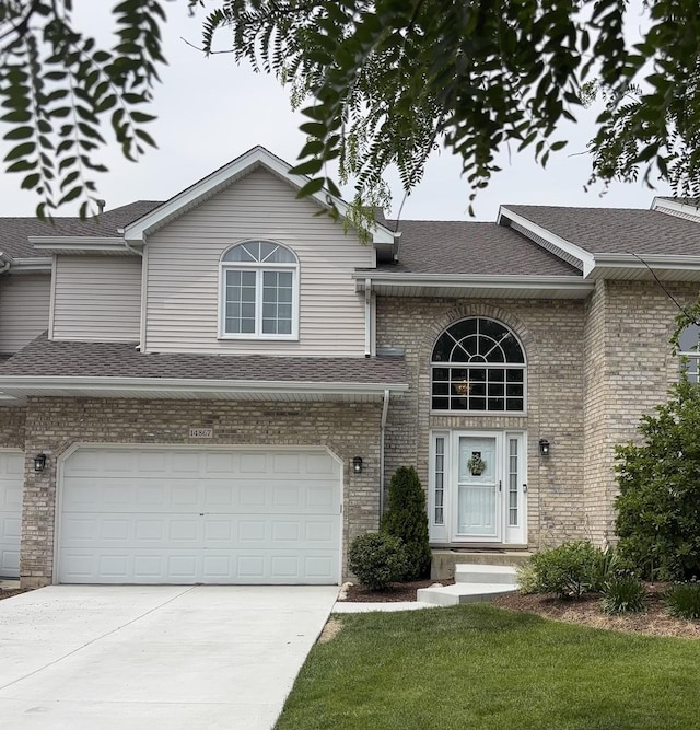 14867 Steven Ct, Lemont, IL 60439 - view of front of property with driveway, a shingled roof, brick siding, an attached garage, and a front lawn