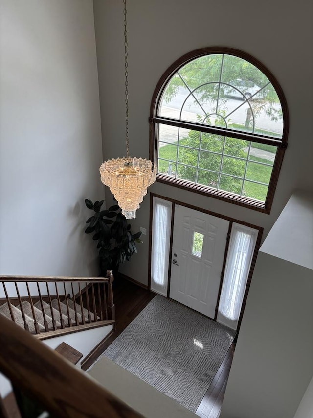 14867 Steven Ct, Lemont, IL 60439 - entryway with a chandelier, a towering ceiling, wood finished floors, and plenty of natural light