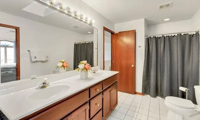 14867 Steven Ct, Lemont, IL 60439 - bathroom featuring double vanity, tile patterned floors, and a shower with curtain