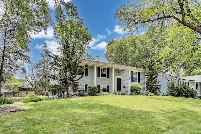 115 Circle Dr W, Montgomery, IL 60538 - split foyer home featuring a front lawn and a chimney
