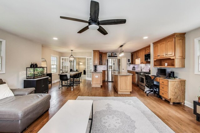 115 Circle Dr W, Montgomery, IL 60538 - living room with a ceiling fan, an office area, dark wood-style flooring, and recessed lighting