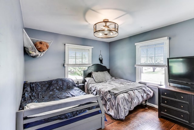 115 Circle Dr W, Montgomery, IL 60538 - bedroom with dark wood finished floors