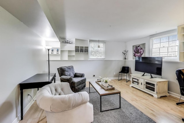 115 Circle Dr W, Montgomery, IL 60538 - living area featuring healthy amount of natural light and wood finished floors