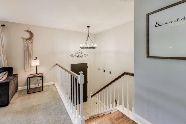 115 Circle Dr W, Montgomery, IL 60538 - stairs with a chandelier and baseboards
