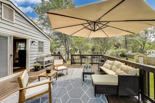 115 Circle Dr W, Montgomery, IL 60538 - view of patio with outdoor lounge area, a deck, and a storage shed
