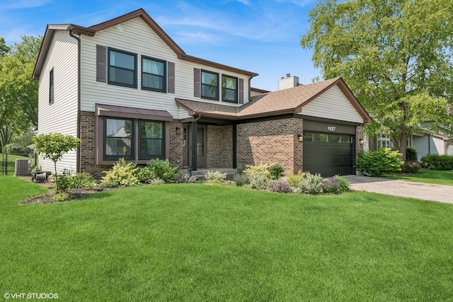 1227 Timber Dr, Elk Grove Village, IL 60007 - view of front facade with brick siding, a garage, a front yard, and concrete driveway