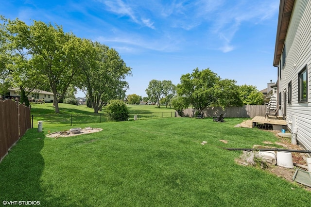 1227 Timber Dr, Elk Grove Village, IL 60007 - fenced backyard featuring a wooden deck and an outdoor fire pit