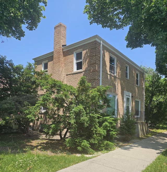 1701 N Sayre Ave, Chicago, IL 60707 - view of property exterior featuring a chimney and brick siding