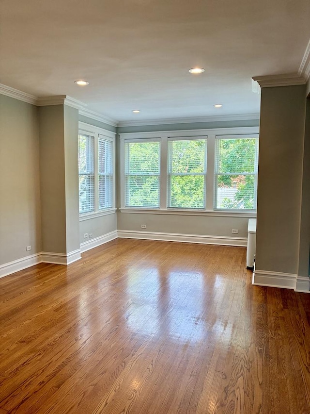 1961 W Winona Ave Unit 3, Chicago, IL 60640 - empty room featuring plenty of natural light, ornamental molding, wood finished floors, and recessed lighting