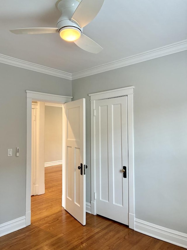 1961 W Winona Ave Unit 3, Chicago, IL 60640 - unfurnished bedroom featuring ornamental molding, wood finished floors, and a ceiling fan