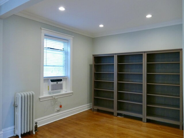 1961 W Winona Ave Unit 3, Chicago, IL 60640 - empty room with radiator, ornamental molding, cooling unit, wood finished floors, and recessed lighting