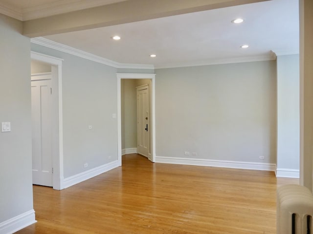 1961 W Winona Ave Unit 3, Chicago, IL 60640 - empty room featuring radiator heating unit, light wood finished floors, recessed lighting, and ornamental molding
