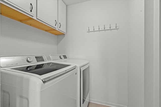 2680 Jenna Cir, Montgomery, IL 60538 - washroom with cabinet space and washer and clothes dryer