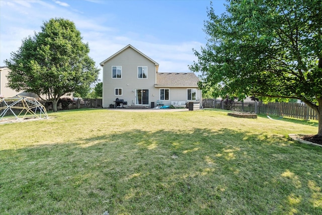 2680 Jenna Cir, Montgomery, IL 60538 - rear view of property with a fenced backyard and a patio area