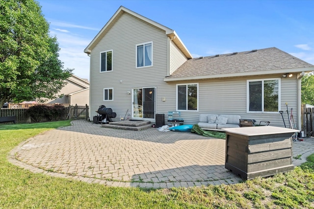 2680 Jenna Cir, Montgomery, IL 60538 - back of house featuring a patio, outdoor lounge area, and roof with shingles