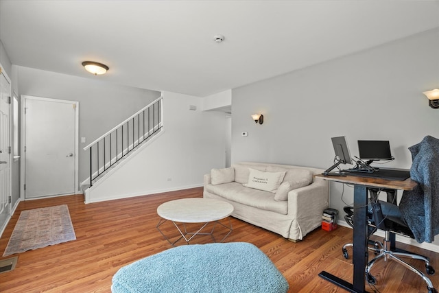 2680 Jenna Cir, Montgomery, IL 60538 - living room featuring stairs, a desk, and wood finished floors