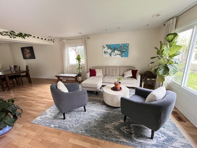 10 Chestnut Ct E, Buffalo Grove, IL 60089 - living area featuring plenty of natural light, light wood finished floors, and recessed lighting