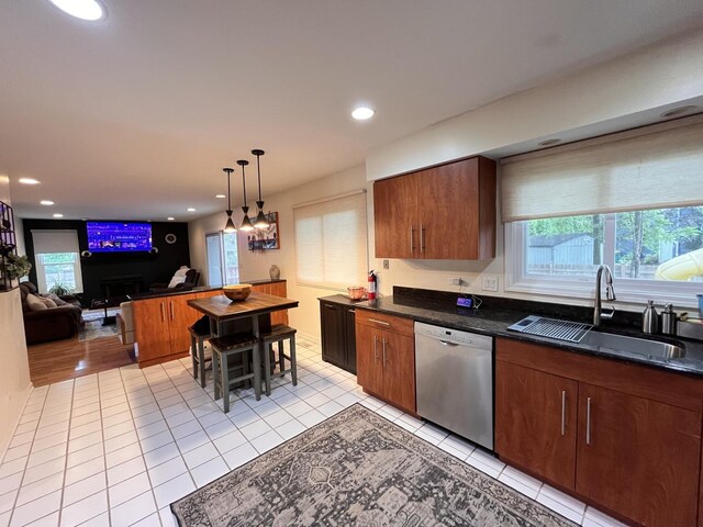 10 Chestnut Ct E, Buffalo Grove, IL 60089 - kitchen with stainless steel dishwasher, plenty of natural light, light tile patterned floors, recessed lighting, and pendant lighting