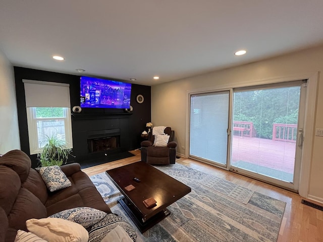 10 Chestnut Ct E, Buffalo Grove, IL 60089 - living area with light wood-type flooring, recessed lighting, and a fireplace