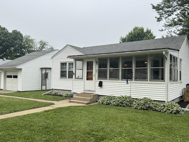 901 N Knox St, Princeton, IL 61356 - view of front of property with a shingled roof, a front lawn, entry steps, and a garage