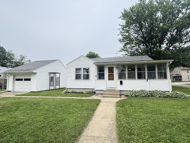 901 N Knox St, Princeton, IL 61356 - view of front facade featuring a garage, a front yard, entry steps, and a shingled roof