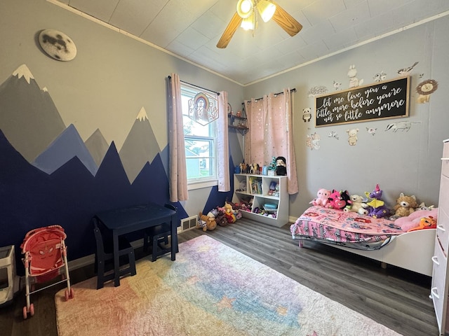 901 N Knox St, Princeton, IL 61356 - bedroom with wood finished floors, ornamental molding, and a ceiling fan