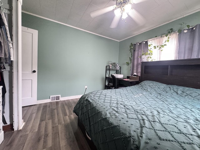901 N Knox St, Princeton, IL 61356 - bedroom with crown molding, wood finished floors, and ceiling fan