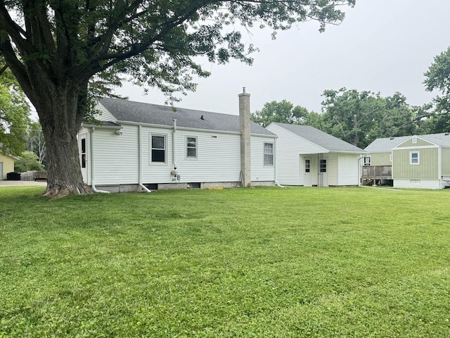 901 N Knox St, Princeton, IL 61356 - back of house with a chimney and a lawn