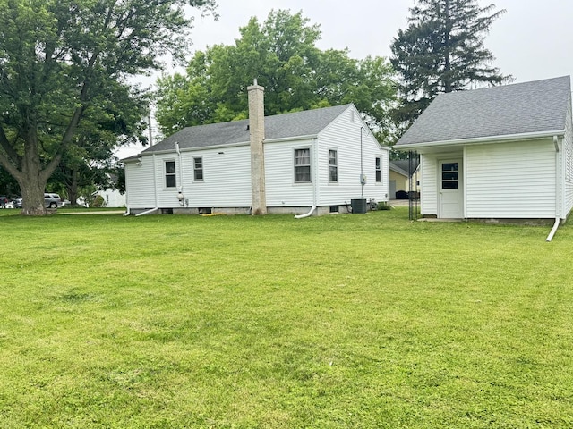 901 N Knox St, Princeton, IL 61356 - back of house featuring a lawn, a shingled roof, and a chimney