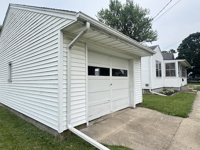 901 N Knox St, Princeton, IL 61356 - view of home's exterior featuring a garage, concrete driveway, and a lawn