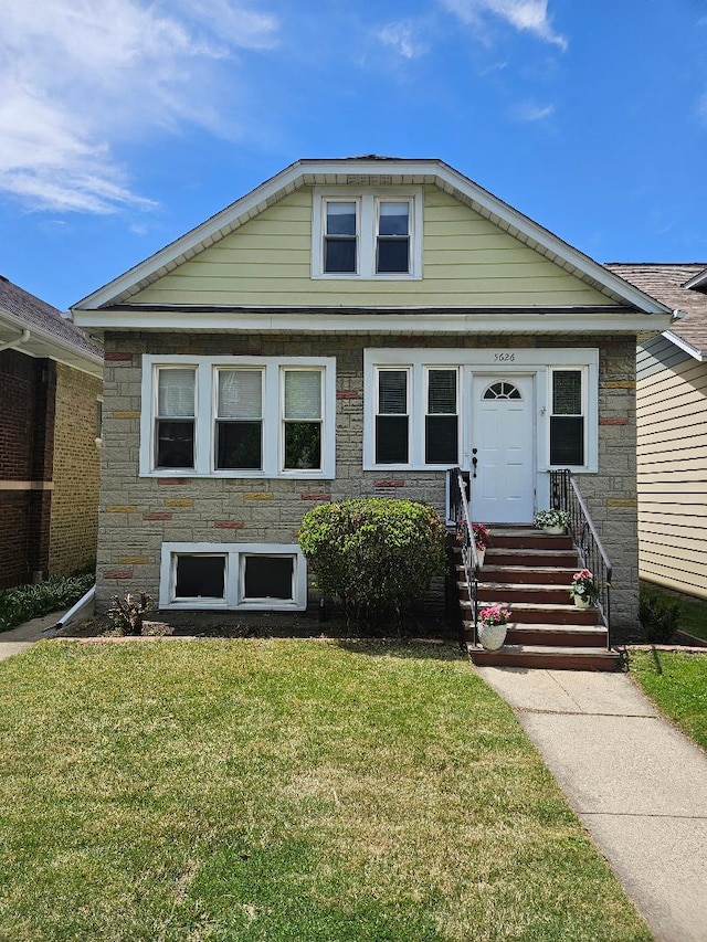 5626 N Mcvicker Ave, Chicago, IL 60646 - view of front facade featuring a front lawn and stone siding